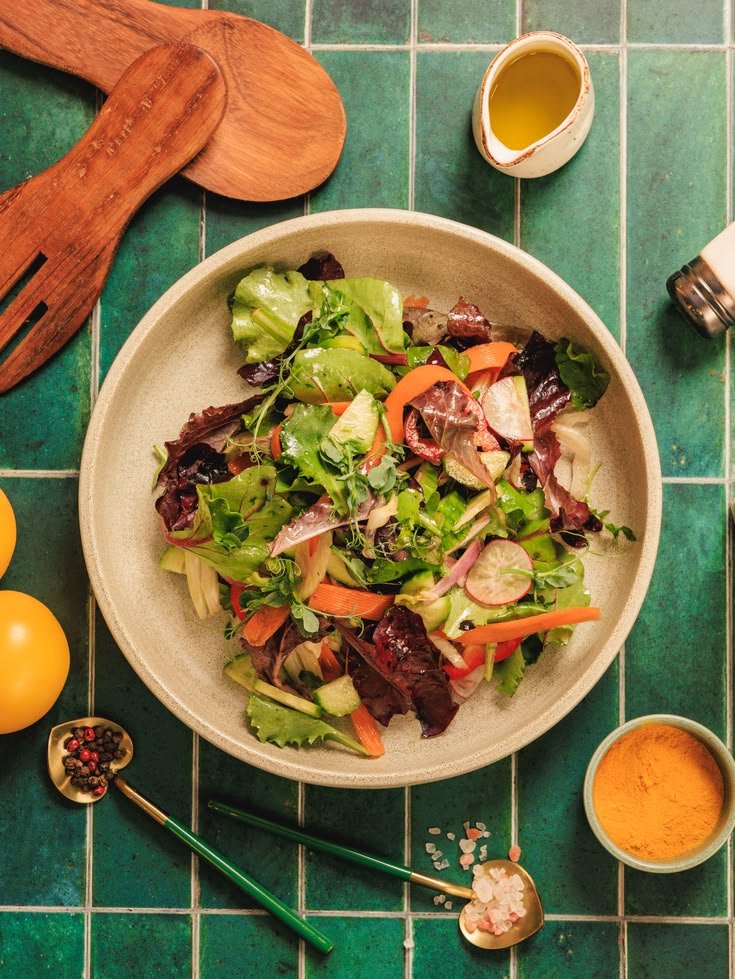 Crates of fresh leafy greens and vegetables